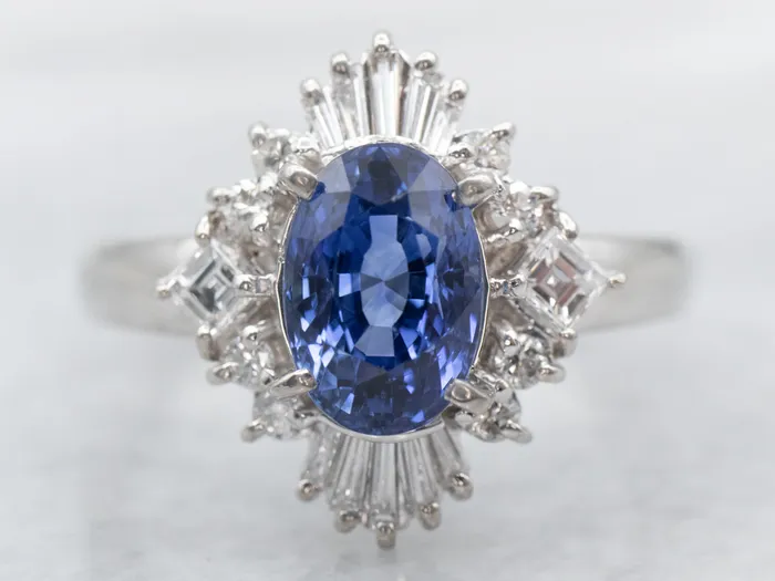 Rings Market Square Jewelers Platinum Oval Cut Sapphire Engagement Ring with Round and Baguette Cut Diamond Halo Rings Market Square Jewelers Platinum Oval Cut Sapphire Engagement Ring with Round and Baguette Cut Diamond Halo